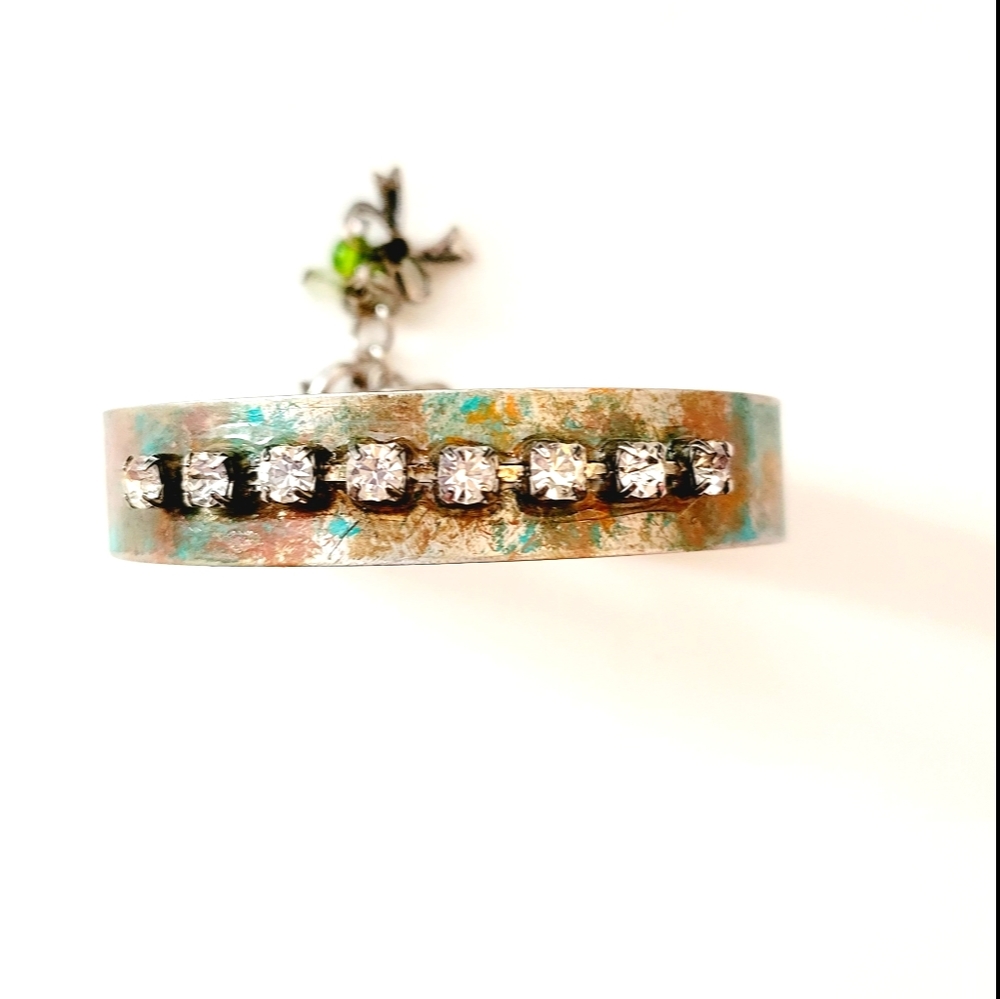 Beautiful metal bracelet with charms